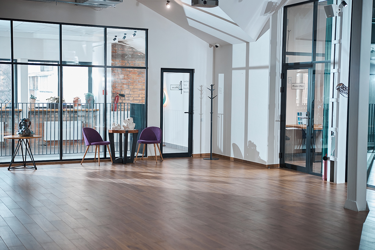 Refinished hardwood floor in a bright empty room, ready for furniture